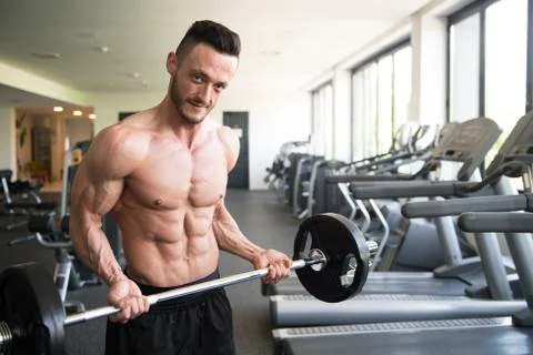 Biceps Exercise With Barbell Stock Photos