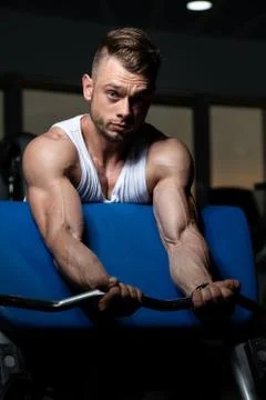 Biceps Exercise With Barbell Stock Photos