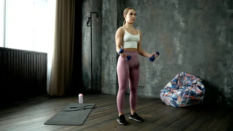 Biceps exercise with dumbbells Stock Footage 201596588