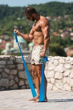 Biceps Exercise Using Resistance Bands Stock Photos