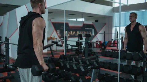 Biceps workout with dumbbells. Loop Stock Footage 82350105