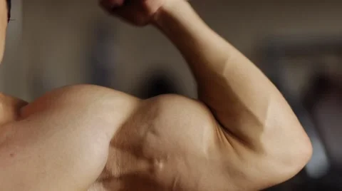 Biceps workout in machine. Slow motion Stock Footage 55007868