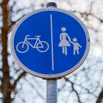 Bicycle and pedestrian path sharing road sign Stock Photos