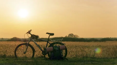 Bicycle and sunset 4K with focus approach. Time lapse. RAW output, without birds Vídeo Stock 63393330