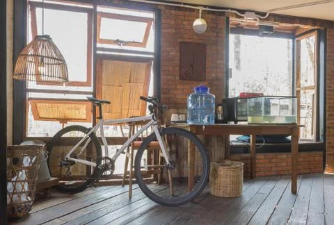 Bicycle and Window and Table in Country Loft Interior Design Room Stock Photos
