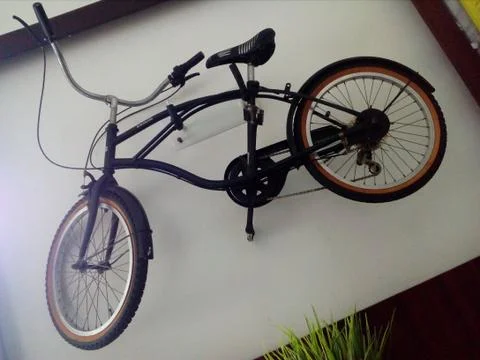 Bicycle Attached to a Wall Stock Photos