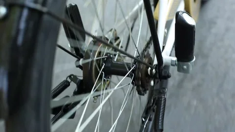 Bicycle back wheel roll close up Stock Footage 147910020