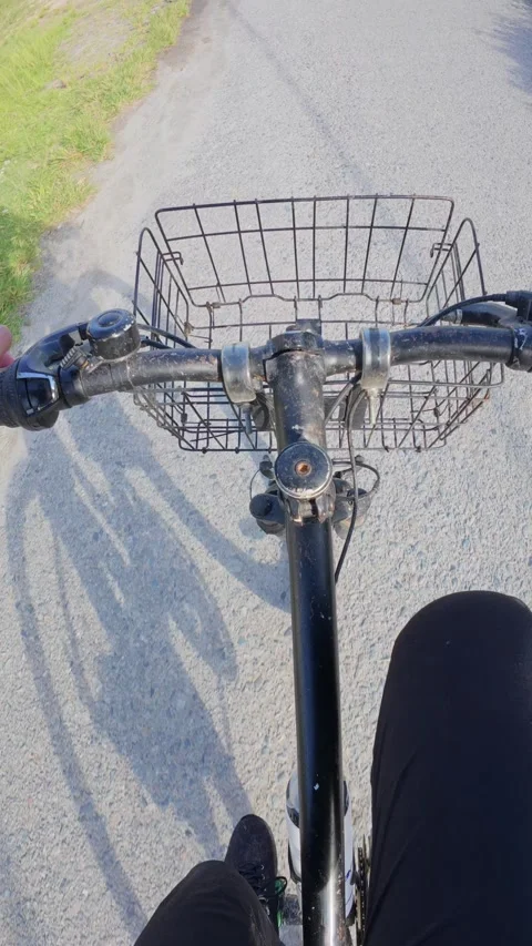 Bicycle with basket on the road, close-up view. POV. Stock Footage 300529295