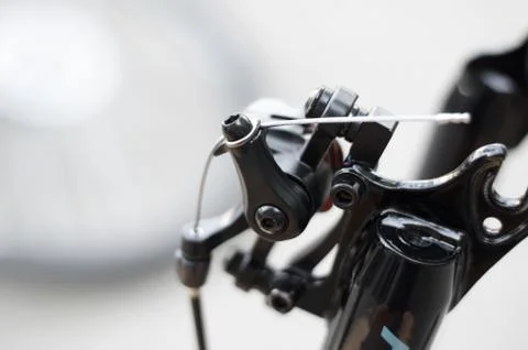 Bicycle brake cable and fork part of front disc brakes. Bicycle repair. Stock Photos