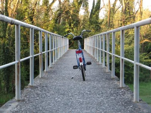 Bicycle on a bridge Stock Photos
