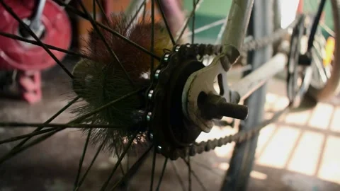 Bicycle chain running in circle while paddling. the back wheel view with clos Stock Footage 130460448