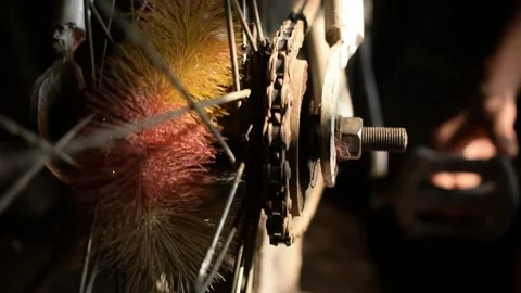 Bicycle chain running in circle while paddling. the back wheel view with clos Stock Footage 130836418