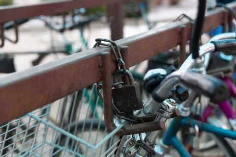 Bicycle chained to a parking. Stock Photos