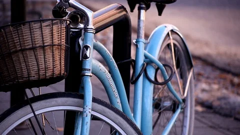 Bicycle chained on a street Stock Footage 101988873