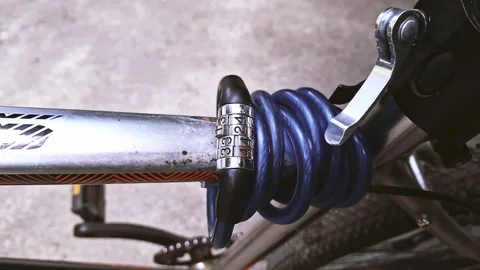 Bicycle combination lock on bicycle frame Stock Footage 314994161