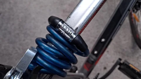 Bicycle combination lock on bicycle frame Stock Footage 314994164