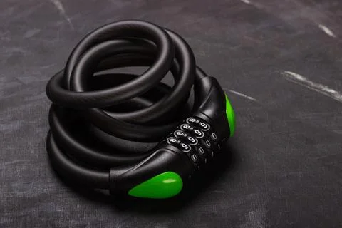 Bicycle combination lock on black background Stock Photos