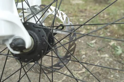 Bicycle disk brake rotor in focus. Stock Photos