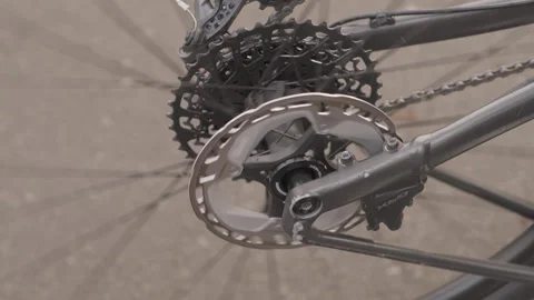 Bicycle drivetrain close up with chainring and cassette Video stock 327524248