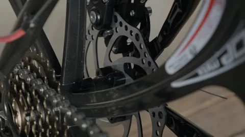 Bicycle drivetrain sprockets, bicycle chain close-up. Fashionable Sports Bike on Stock Footage 257767253