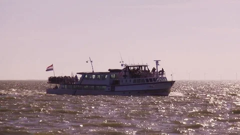 Bicycle ferry in nice orange sunset on the IJsselmeer Stock Footage 118882538