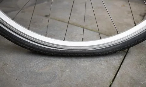 Bicycle with flat tire Stock Photos