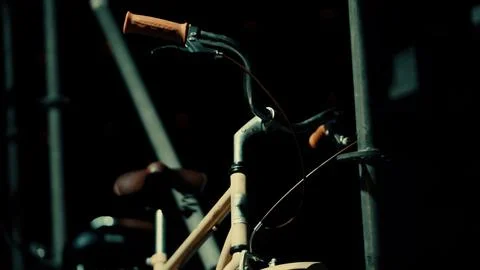 Bicycle frame and handlebars glow in low light Stock Photos
