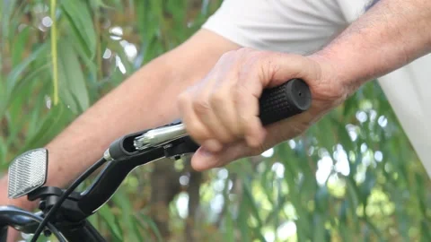 Bicycle handlebars close up. The hand presses the brake Vídeos de archivo 145181750