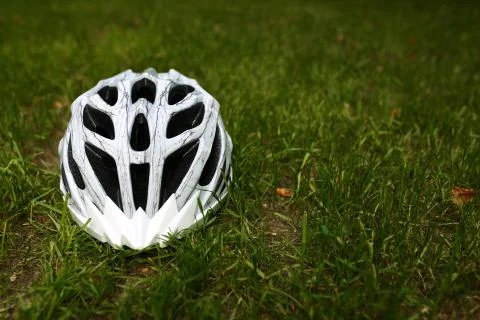 Bicycle helmet on grass Stock Photos