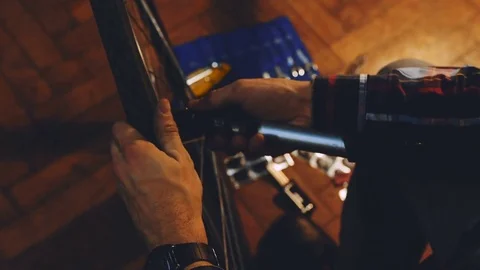 Bicycle mechanic work process in low key cinematic light Video stock 85400398