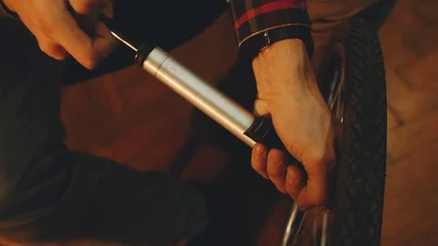 Bicycle mechanic work process in low key cinematic light Stock Footage 85400436