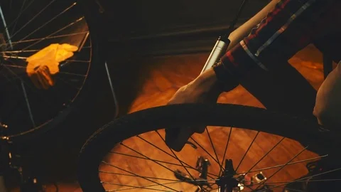 Bicycle mechanic work process in low key cinematic light Stock-Footage 85400489