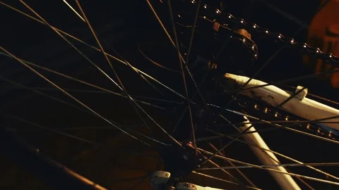 Bicycle mechanic work process in low key cinematic light Stock Footage 85400565