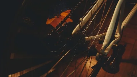 Bicycle mechanic work process in low key cinematic light Stock Footage 85400805