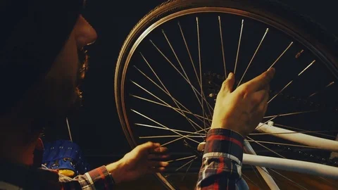 Bicycle mechanic work process in low key cinematic light Video stock 85400904