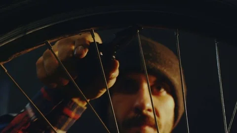 Bicycle mechanic work process in low key cinematic light Video stock 85400938