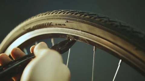 Bicycle mechanic work process in low key cinematic light Stock Footage 85401038