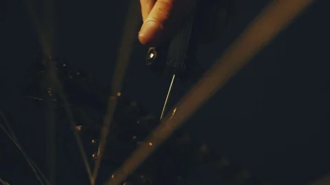 Bicycle mechanic work process in low key cinematic light Stock Footage 85401077