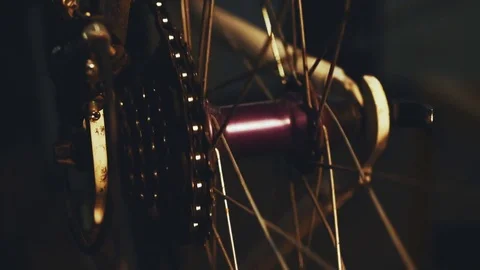 Bicycle mechanic work process in low key cinematic light Stock Footage 85401120