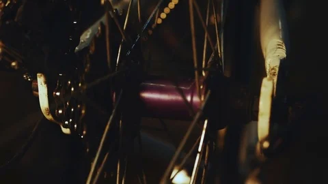 Bicycle mechanic work process in low key cinematic light Stock Footage 85401181