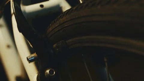 Bicycle mechanic work process in low key cinematic light Stock Footage 85401200