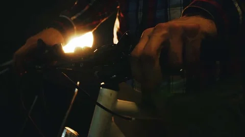 Bicycle mechanic work process in low key cinematic light Stock Footage 85401263