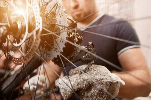 Bicycle mechanic in a workshop in the repair process Stock Photos
