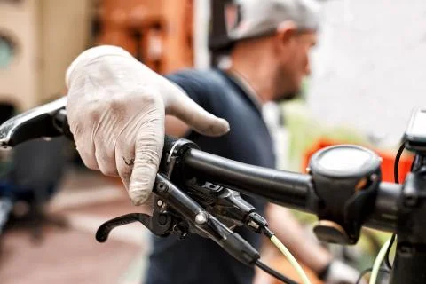 Bicycle mechanic in a workshop in the repair process Stock Photos