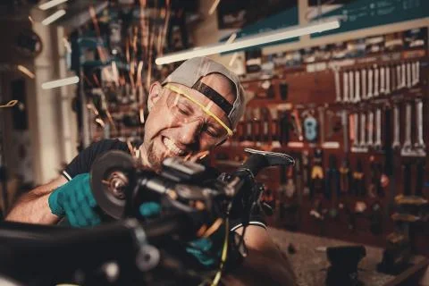 Bicycle mechanic in a workshop in the repair process Stock Photos
