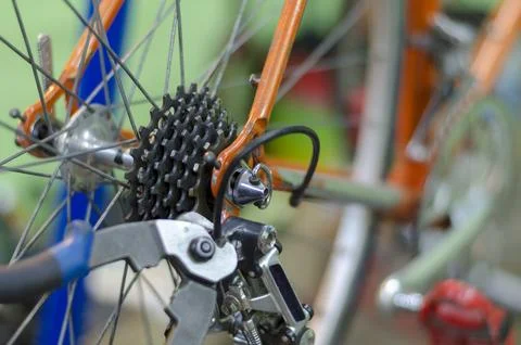 Bicycle mechanic in a workshop in the repair process, holds a tool in his han Stock-Fotos