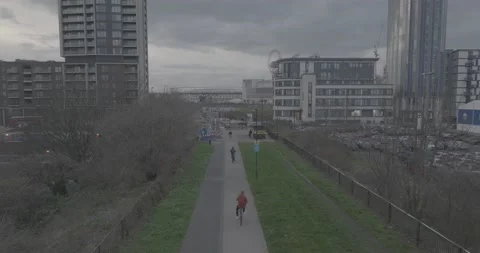 Bicycle moving on track between garden and vehicles parking area Stock Footage 170946754