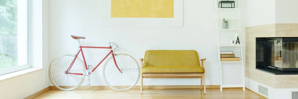 Bicycle next to sofa Stock-Fotos