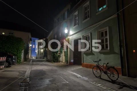 Bicycle on the night european city street Stock Photos