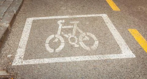 Bicycle painted white on the road to indicate a bicycle pisa Stock Photos